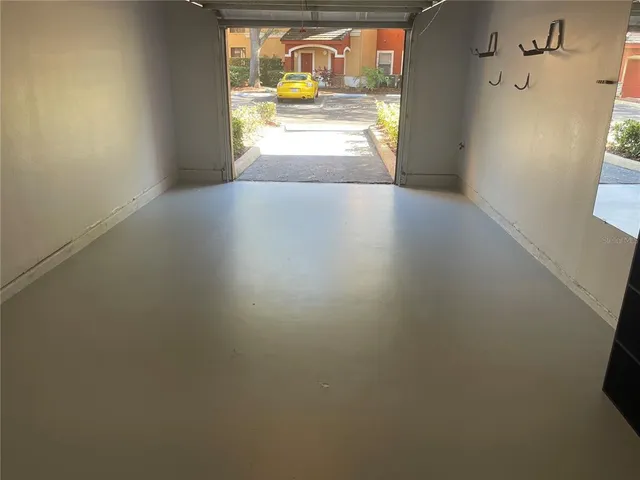 a view of a big room with closet and windows