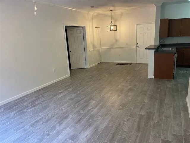 a view of a livingroom with wooden floor