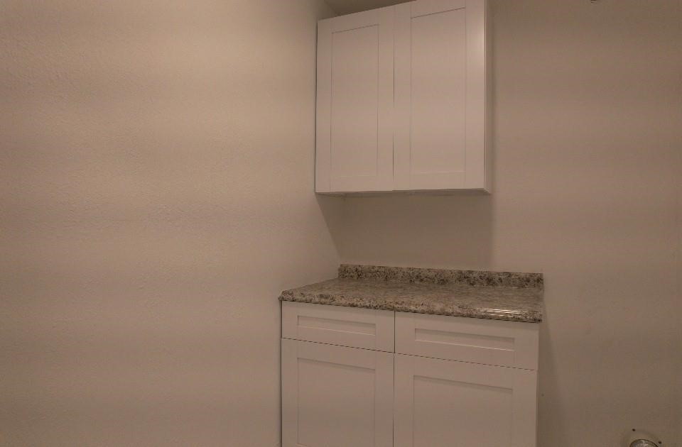 25373 Goodson Road Splendora, TX 77372 - Photo 33 of 41 Bright room with white cabinets and modern design, offering ample storage and counter space.