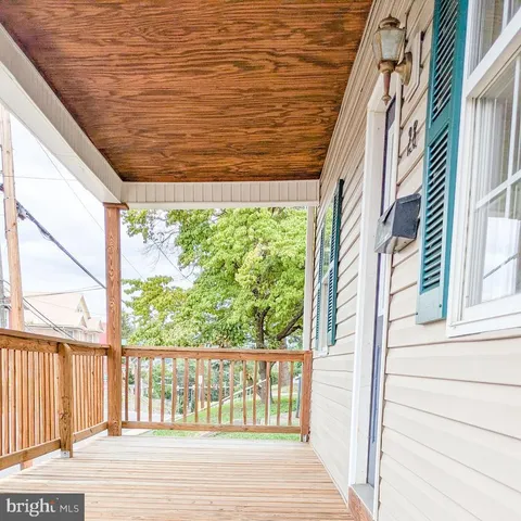 a view of a balcony with outside view