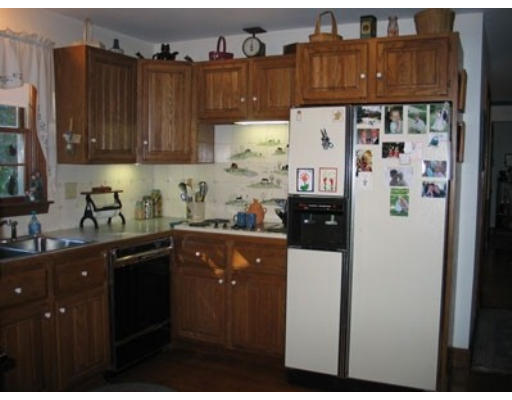 496 Ipswich Road Boxford, MA 01921 - Photo 3 of 6 a kitchen with stainless steel appliances granite countertop a refrigerator and a cabinets