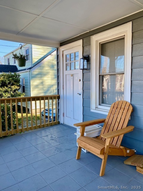 2 Visconti Street Norwalk, CT 06851 - Photo 2 of 9 a blue bench sitting in front of a building