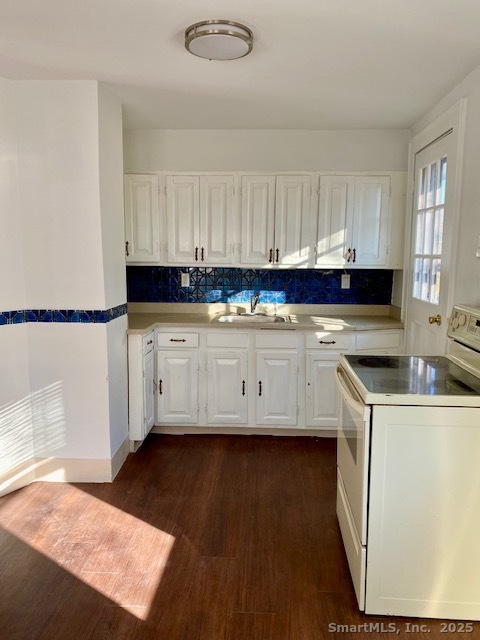 2 Visconti Street Norwalk, CT 06851 - Photo 6 of 9 a kitchen with a sink a stove and cabinets