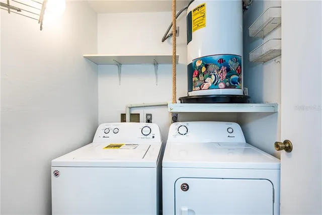 a utility room with dryer and washer