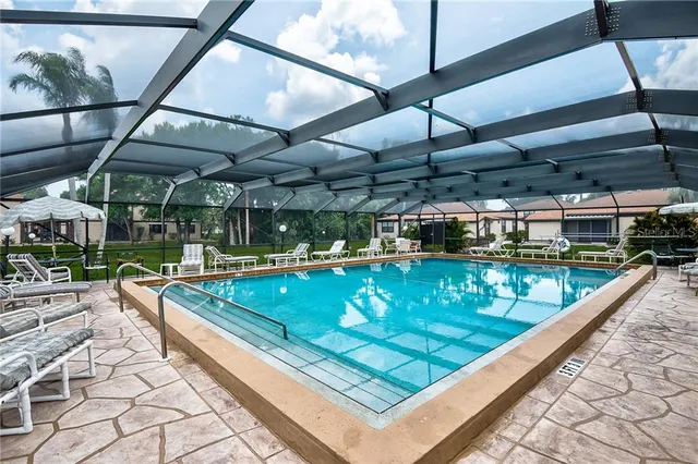 a view of a pool with a patio