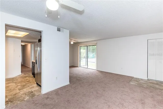 a view of an empty room and window