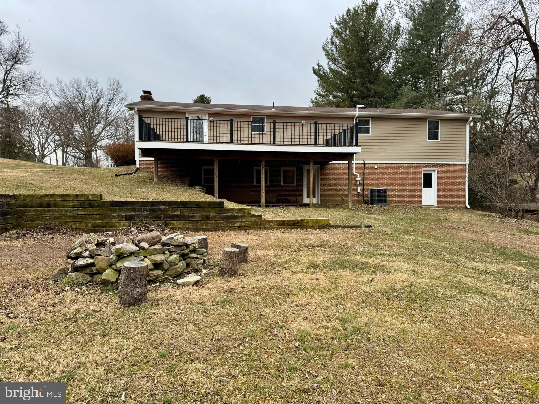 9813 Moyer Road Damascus, MD 20872 - Photo 25 of 31 a front view of a house with a yard