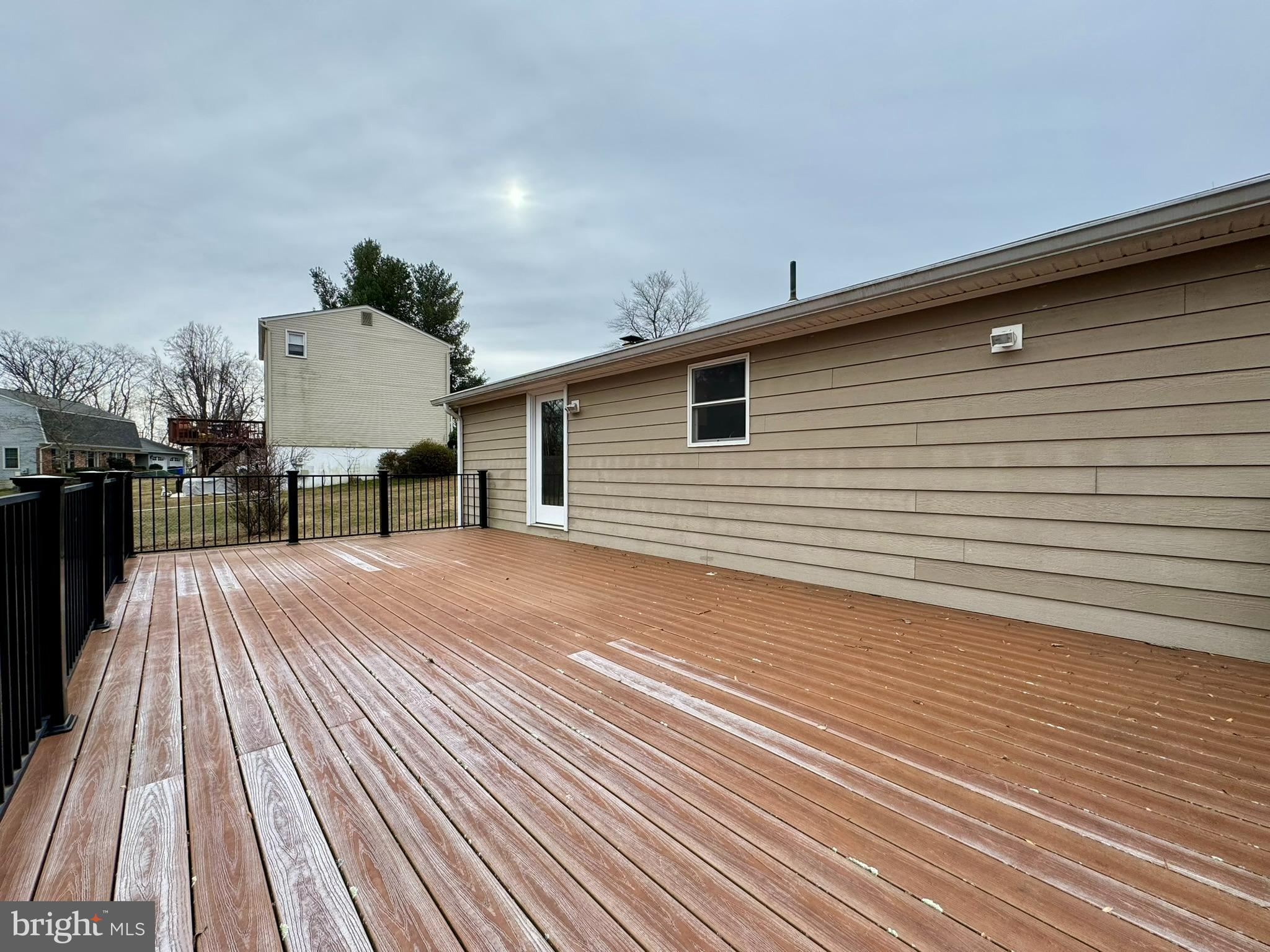 9813 Moyer Road Damascus, MD 20872 - Photo 26 of 31 a view of a terrace with wooden floor