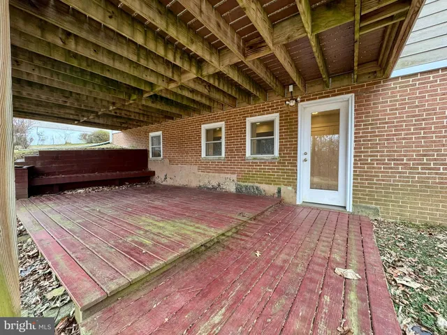 a view of a backyard with wooden floor