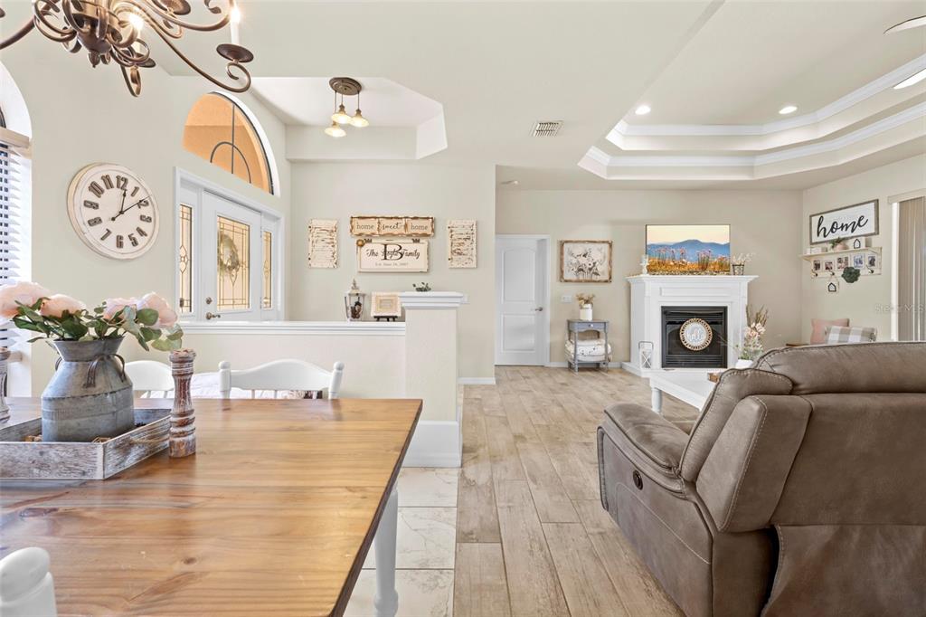 11014 Wren Road Brooksville, FL 34613 - Photo 11 of 50 a living room with furniture and a fireplace