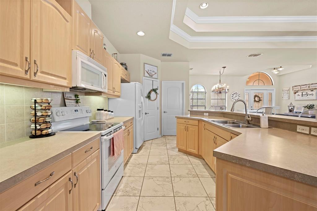 11014 Wren Road Brooksville, FL 34613 - Photo 15 of 50 a large kitchen with a lot of counter space and a sink