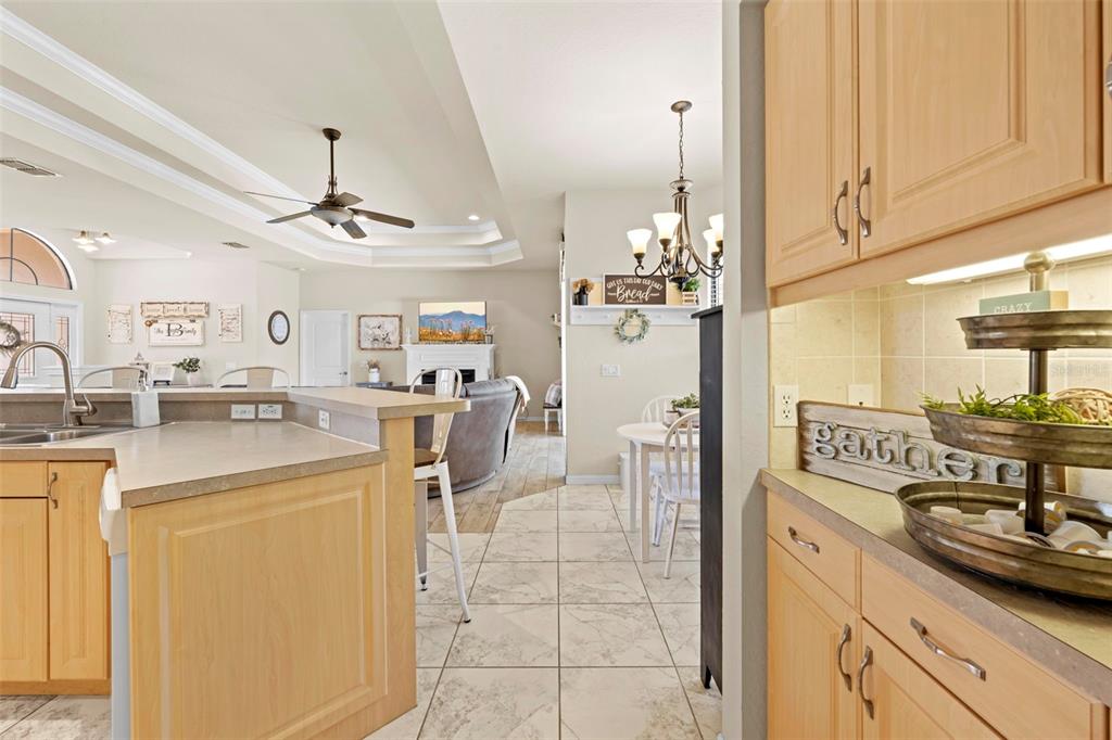 11014 Wren Road Brooksville, FL 34613 - Photo 16 of 50 a kitchen with stainless steel appliances granite countertop a sink a stove and a refrigerator