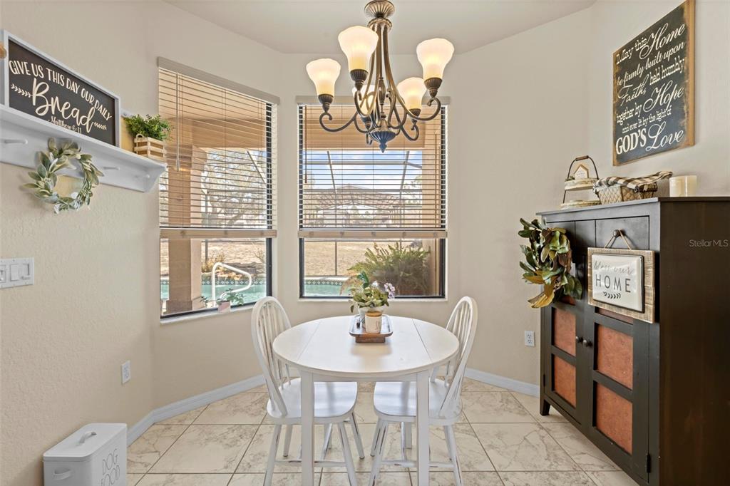 11014 Wren Road Brooksville, FL 34613 - Photo 17 of 50 a dining room with furniture and window