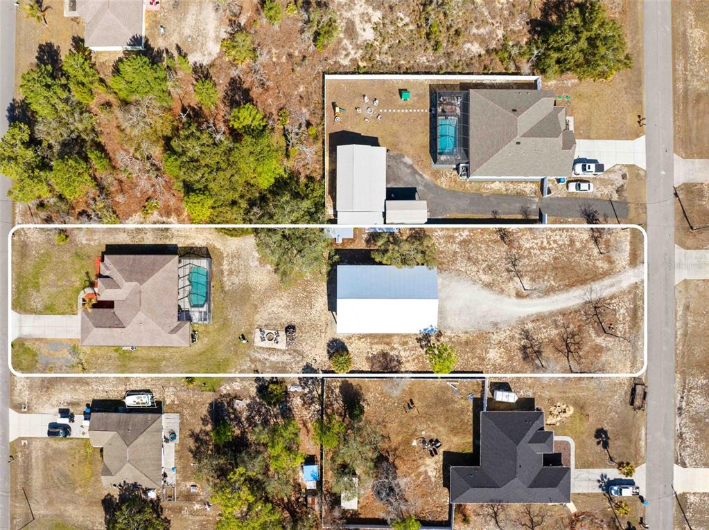 11014 Wren Road Brooksville, FL 34613 - Photo 2 of 50 an aerial view of a houses with outdoor space