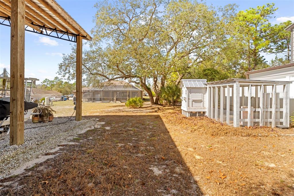 11014 Wren Road Brooksville, FL 34613 - Photo 39 of 50 a view of a backyard with large trees