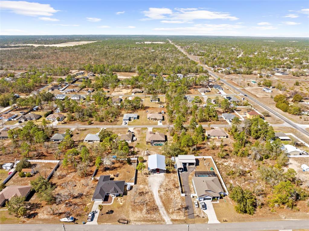 11014 Wren Road Brooksville, FL 34613 - Photo 50 of 50 an aerial view of residential building with parking space