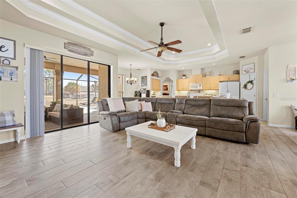 11014 Wren Road Brooksville, FL 34613 - Photo 7 of 50 a living room with furniture and a large window