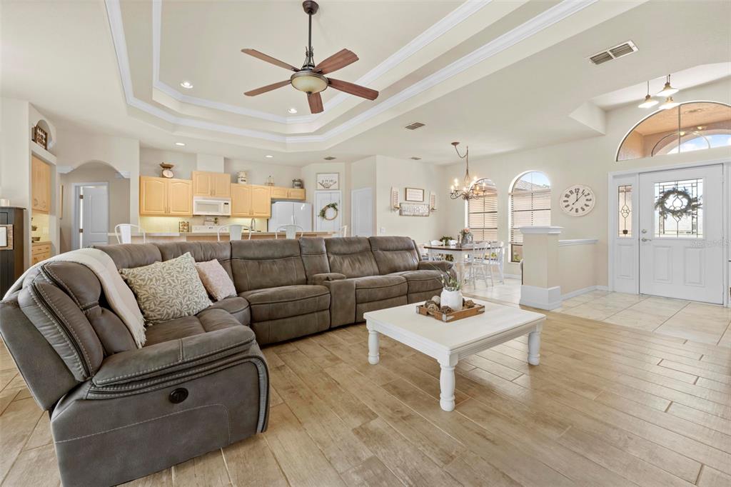 11014 Wren Road Brooksville, FL 34613 - Photo 8 of 50 a living room with furniture and a wooden floor