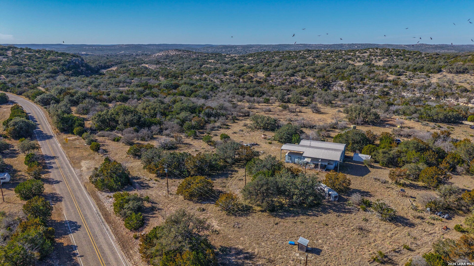 674 St Rocksprings Tx 78880 Rocksprings, TX 78880 - Photo 4 of 27 an aerial view of a house with a yard