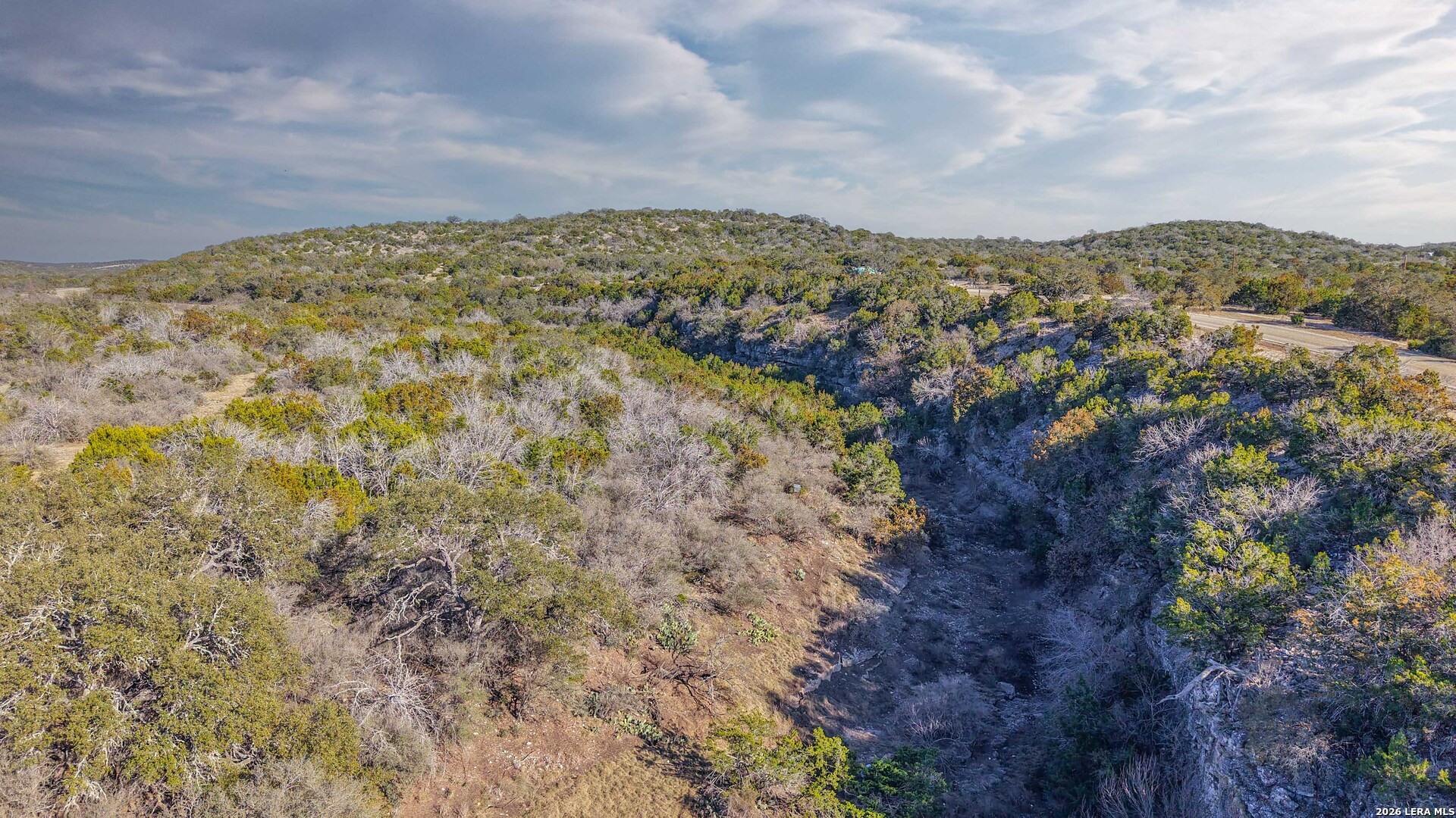 674 St Rocksprings Tx 78880 Rocksprings, TX 78880 - Photo 6 of 27 a view of a large building with mountains in the background