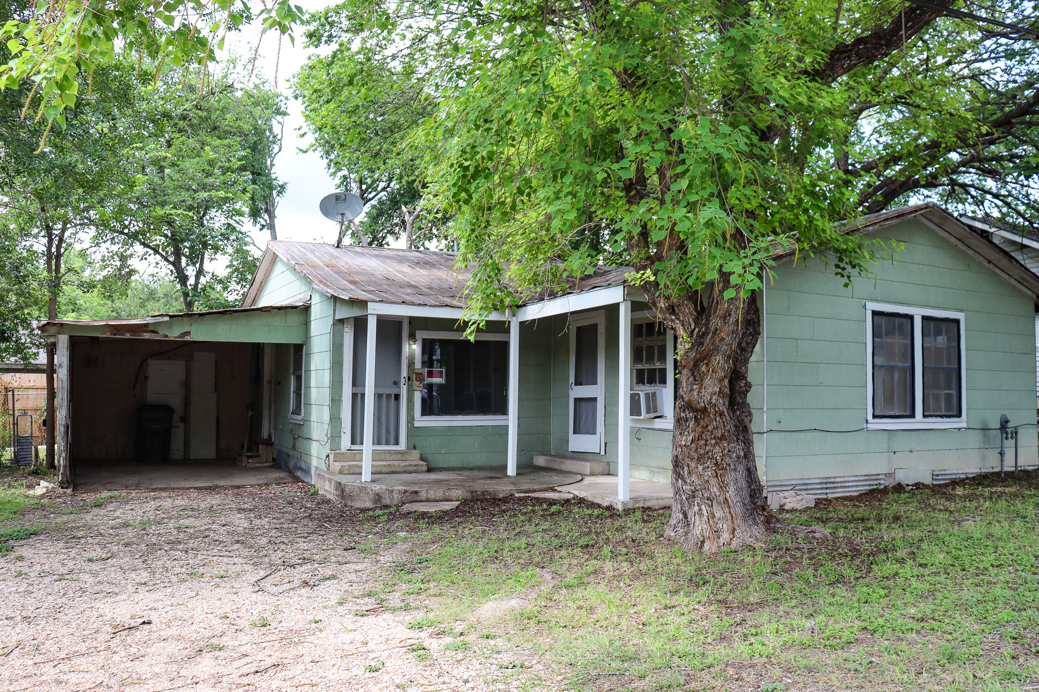 803 3rd Street Lockhart, TX 78644 - Photo 15 of 15 a house that has a tree in front of the house