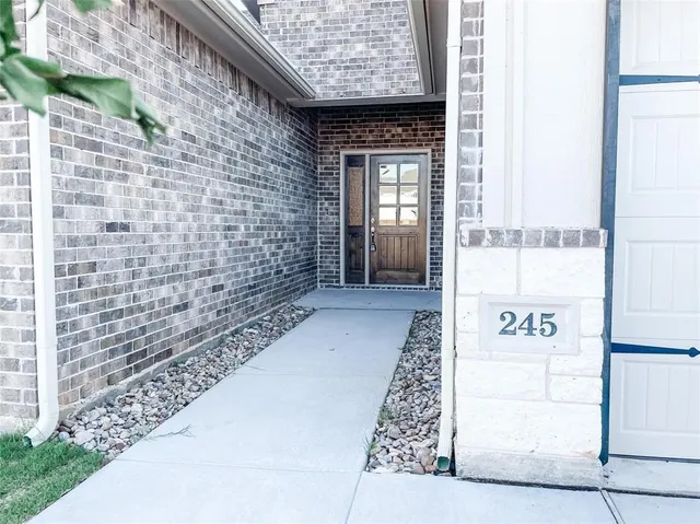 a view of a brick wall with window