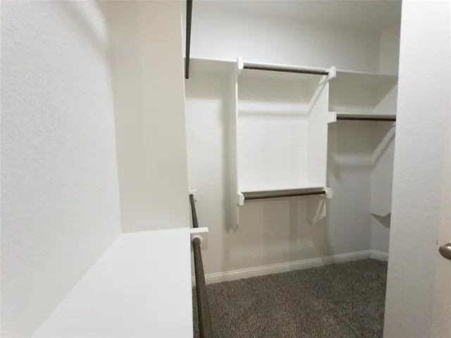 a bathroom with a glass door shower