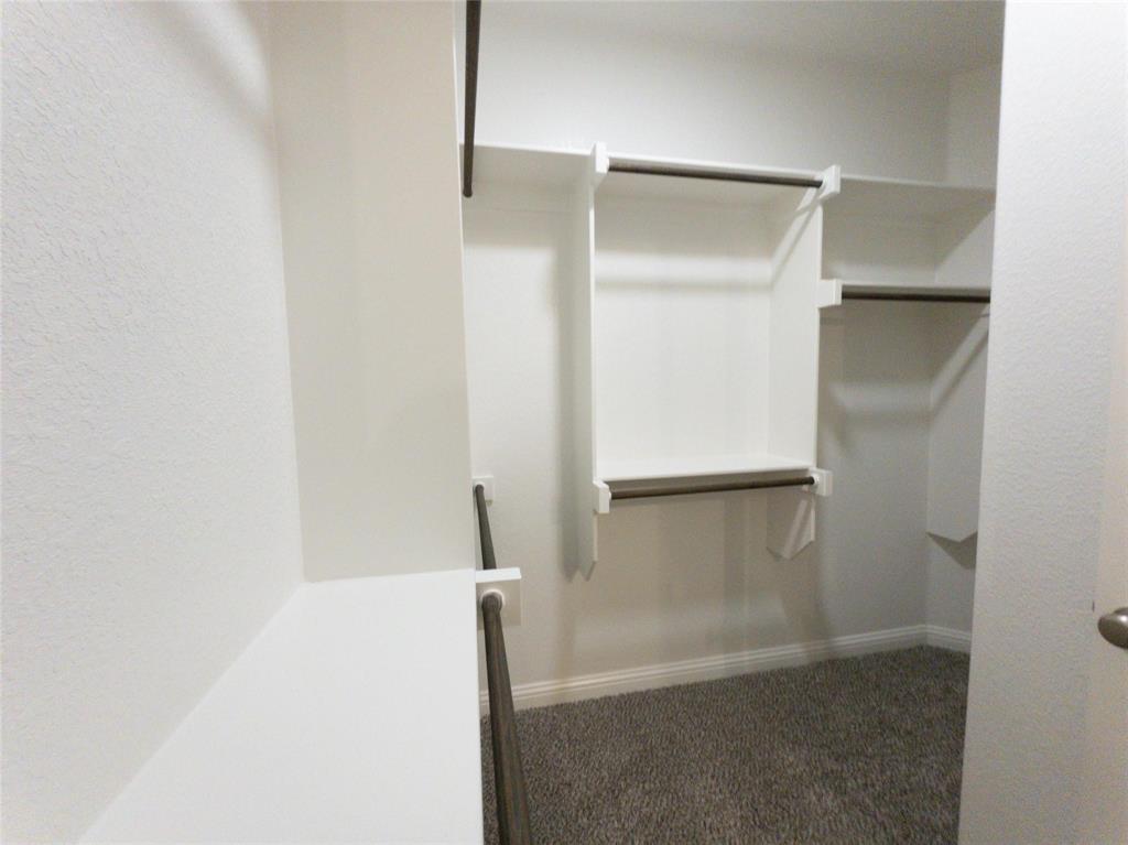 245 Honor Code Place Granbury, TX 76049 - Photo 14 of 16 a bathroom with a glass door shower