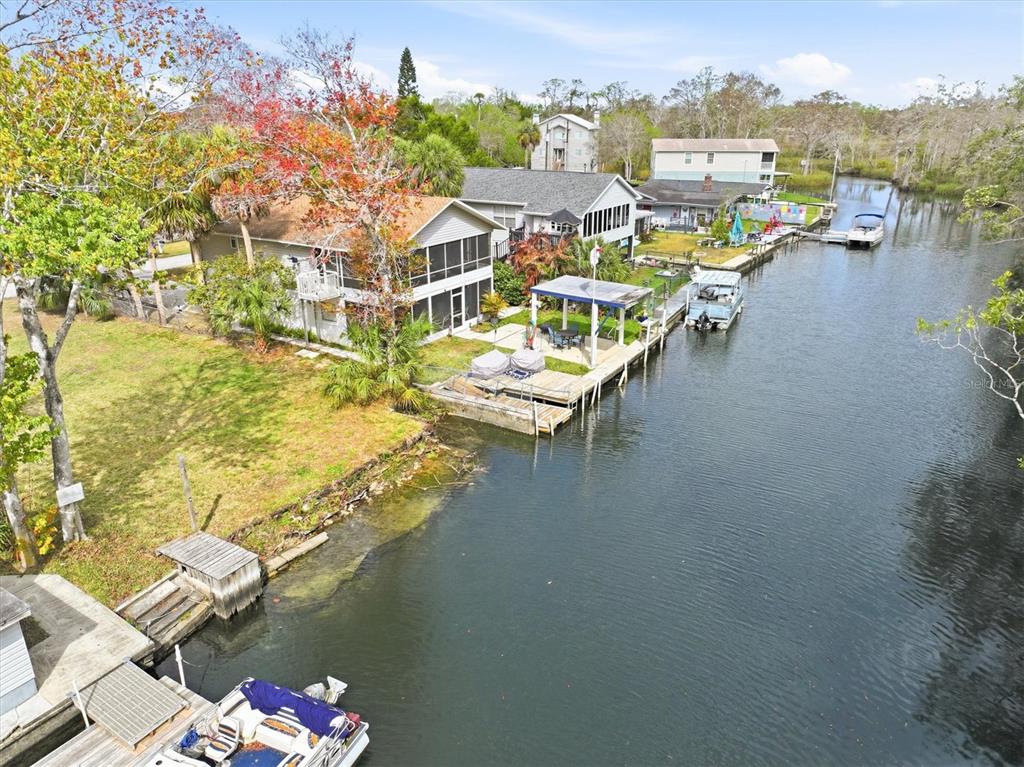 7304 Sunfish Circle Weeki Wachee, FL 34607 - Photo 16 of 23 an aerial view of residential houses with outdoor space