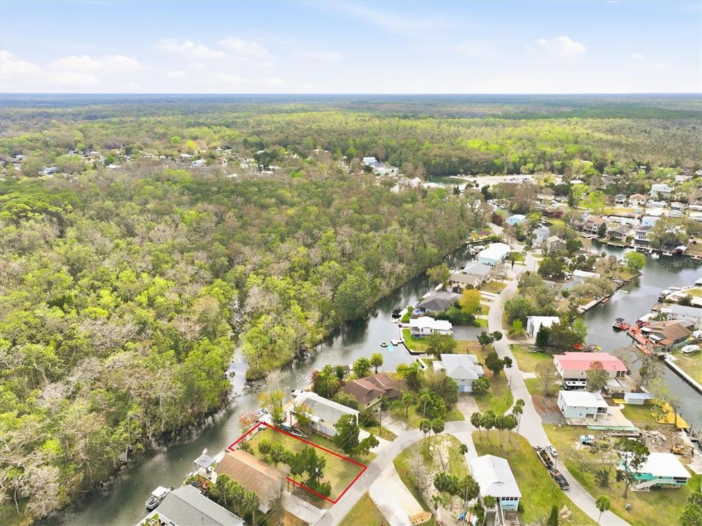 7304 Sunfish Circle Weeki Wachee, FL 34607 - Photo 22 of 23 an aerial view of residential houses with outdoor space and trees