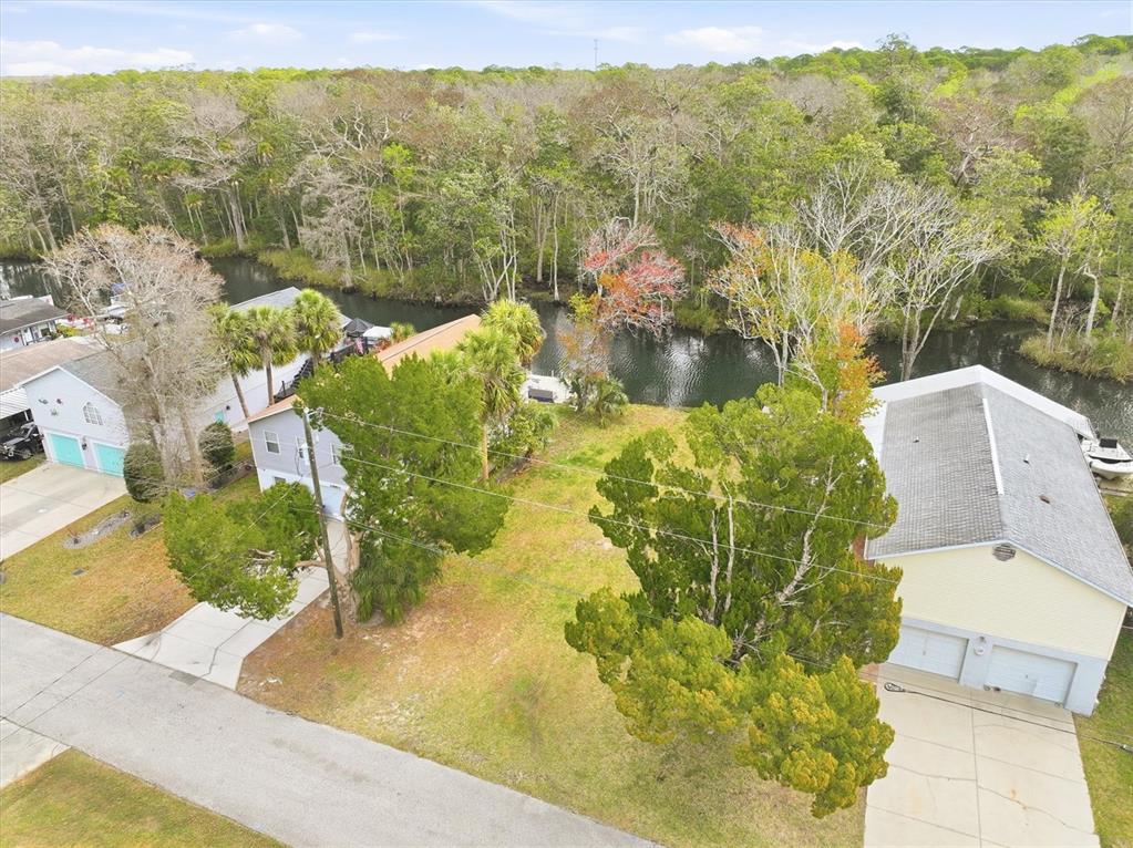 7304 Sunfish Circle Weeki Wachee, FL 34607 - Photo 4 of 23 an aerial view of a house with a yard
