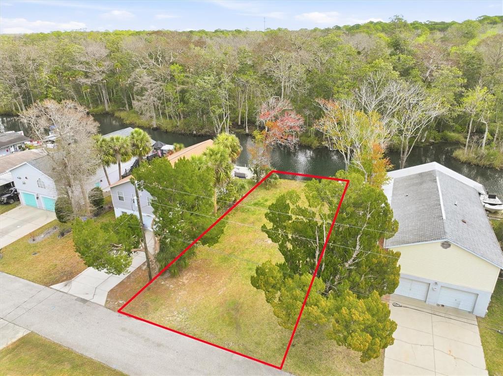 7304 Sunfish Circle Weeki Wachee, FL 34607 - Photo 6 of 23 an aerial view of a house with a yard