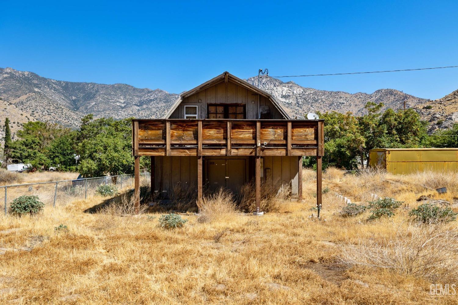 Undisclosed Address Onyx, CA 93255 - Photo 6 of 18 a view of a house with a yard