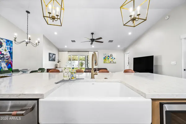 a kitchen with a refrigerator a stove and a microwave