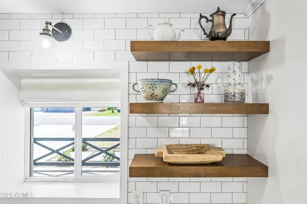 a stove top oven sitting inside of a kitchen