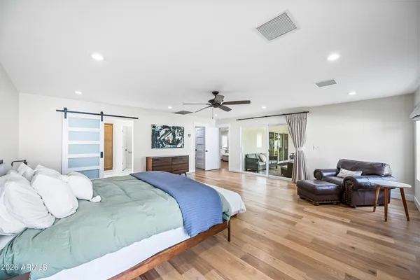 a bathroom with double vanity sinks and a mirror