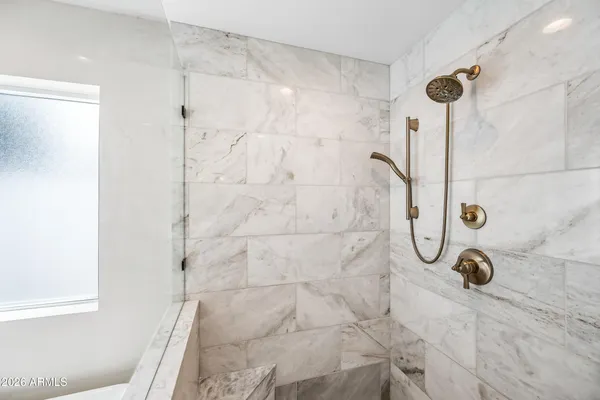 a bathroom with a bathtub shower sink and toilet