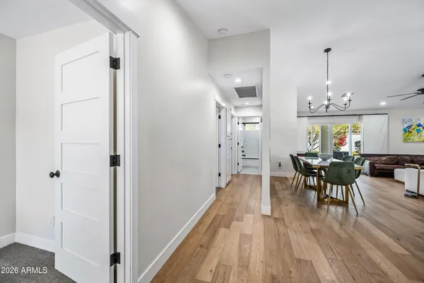 a bedroom with a bed a table and a chair