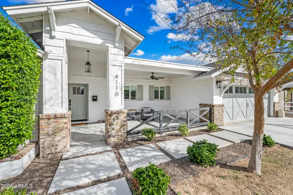 a view of a patio with table and chairs and potted plants