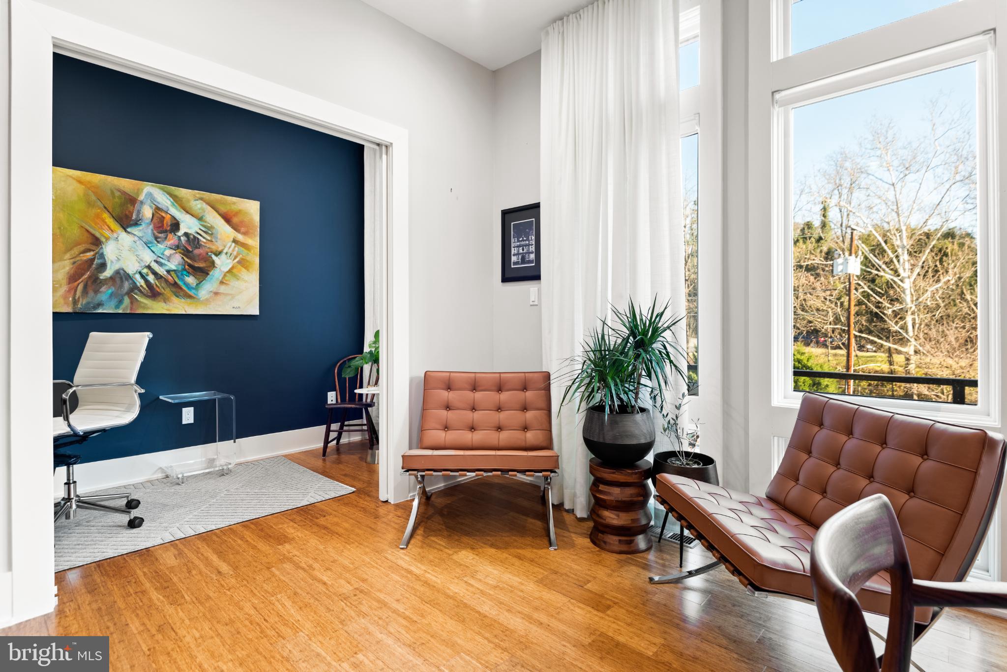 5117 Willet Bridge Road Bethesda, MD 20816 - Photo 11 of 46 a living room with furniture and a flat screen tv