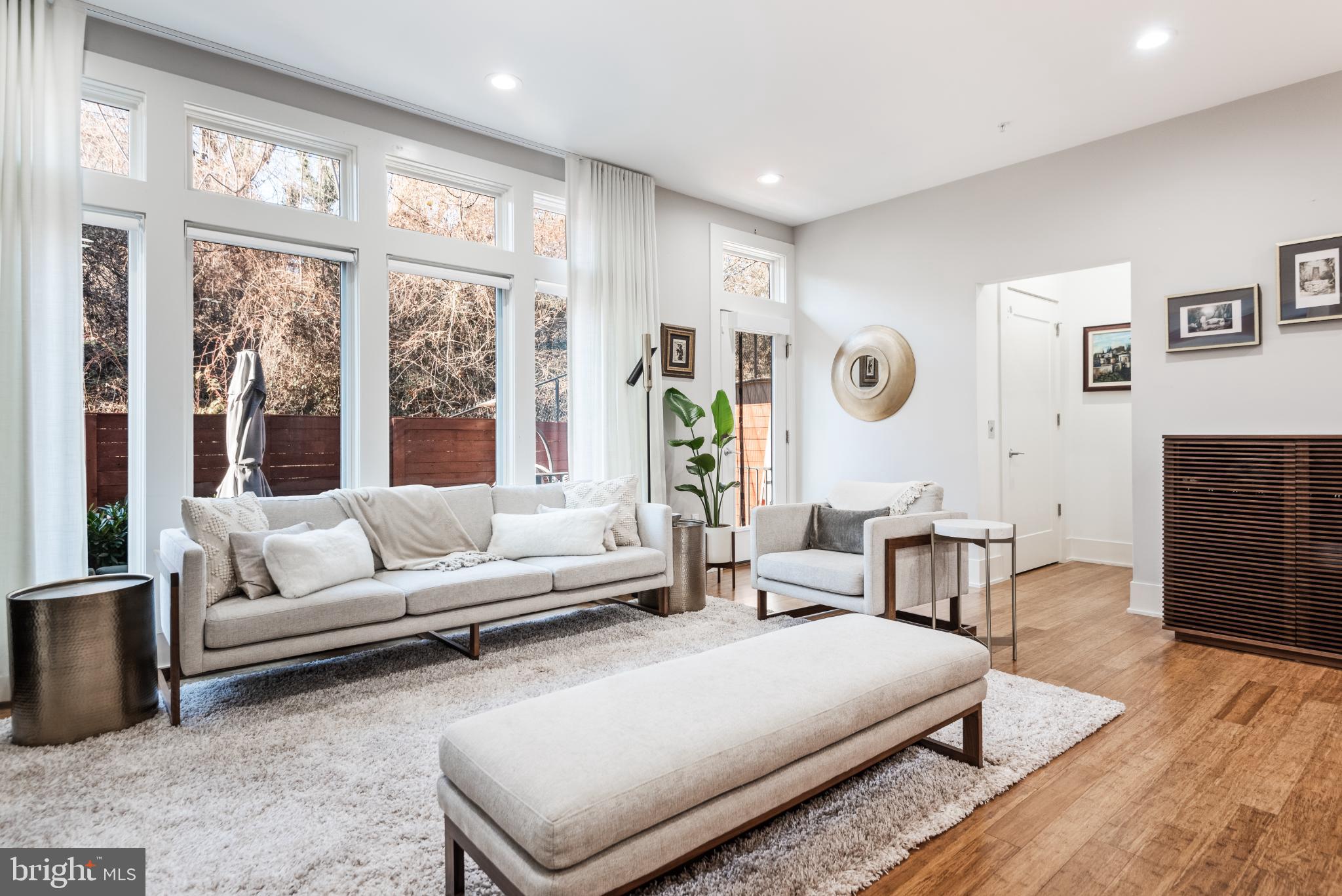 5117 Willet Bridge Road Bethesda, MD 20816 - Photo 20 of 46 a living room with furniture and a large window