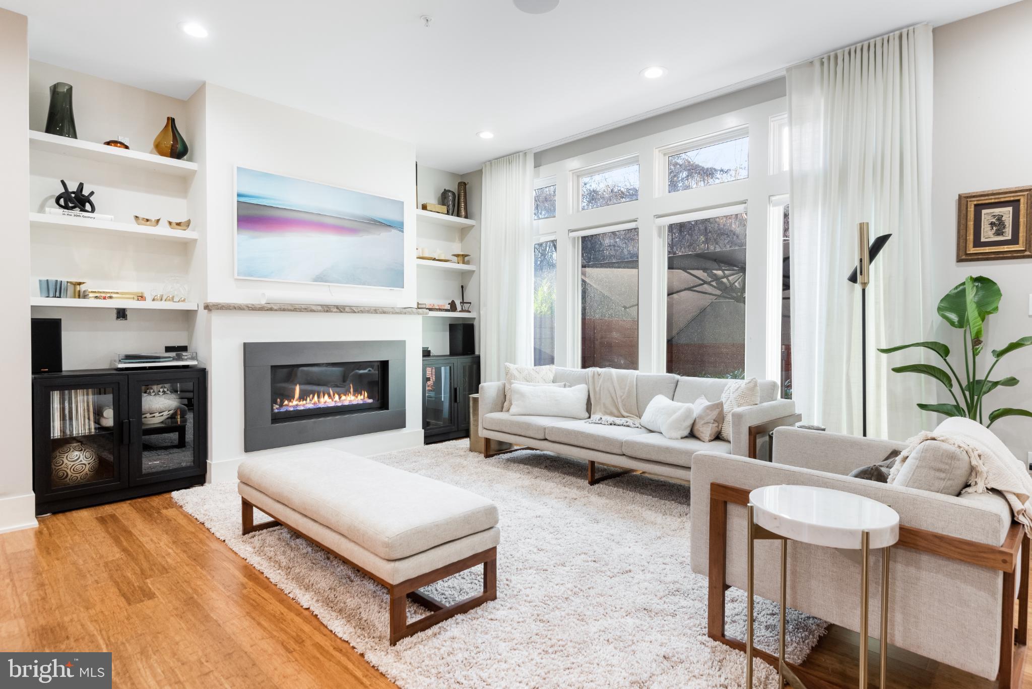 5117 Willet Bridge Road Bethesda, MD 20816 - Photo 21 of 46 a living room with furniture and a fireplace