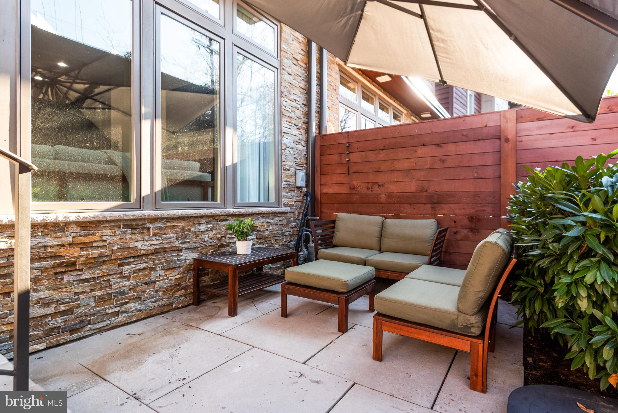 5117 Willet Bridge Road Bethesda, MD 20816 - Photo 22 of 46 a building outdoor space with patio furniture