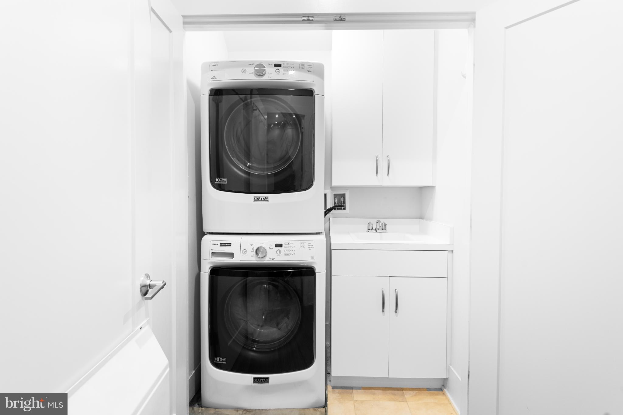 5117 Willet Bridge Road Bethesda, MD 20816 - Photo 35 of 46 a utility room with dryer and washer