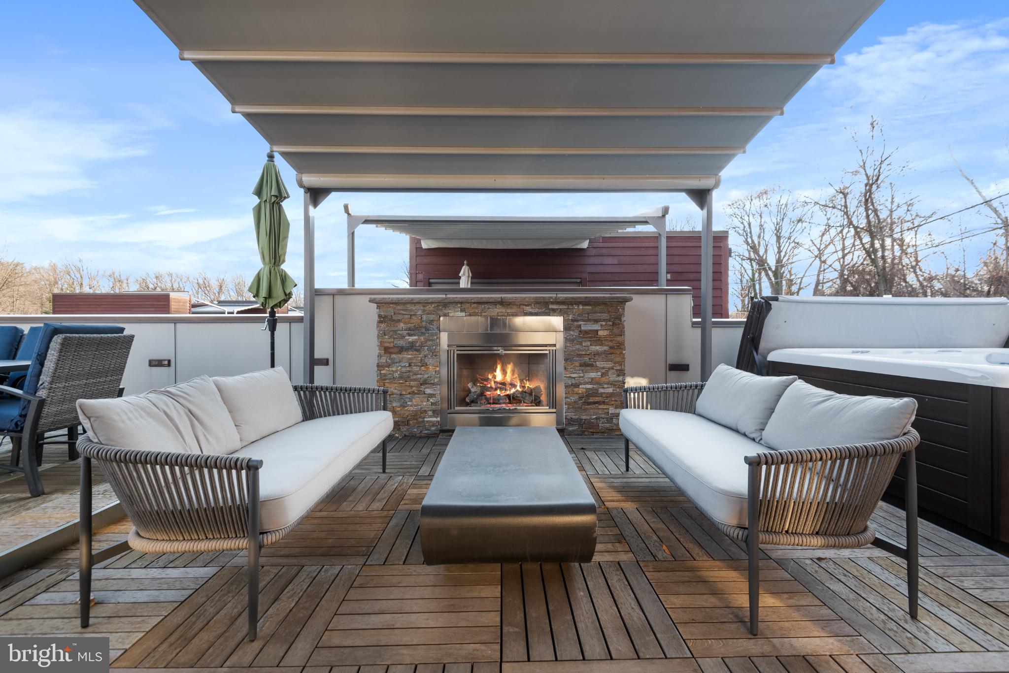 5117 Willet Bridge Road Bethesda, MD 20816 - Photo 37 of 46 a living room with furniture and a fireplace