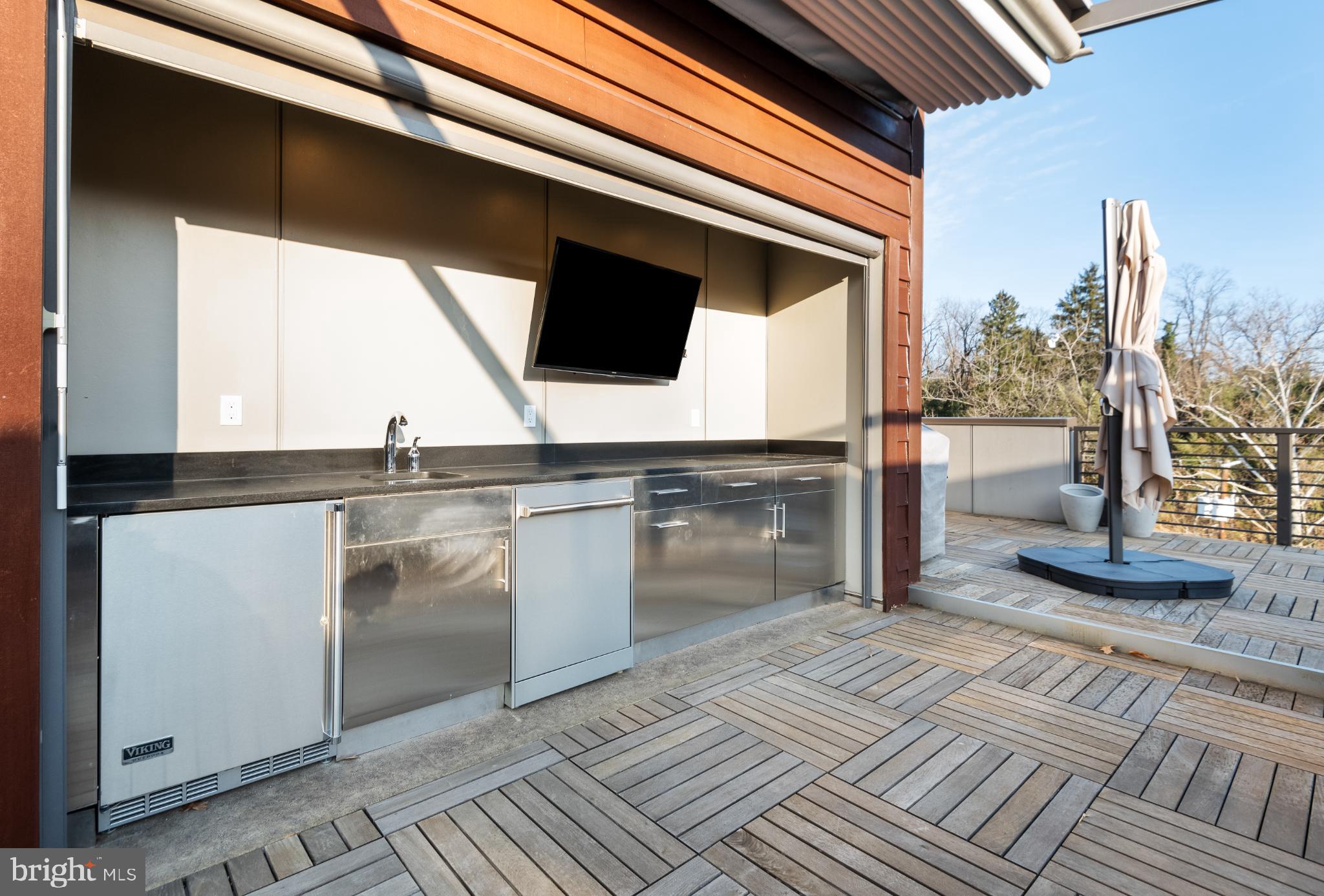 5117 Willet Bridge Road Bethesda, MD 20816 - Photo 42 of 46 a view of a kitchen with a sink and cabinets