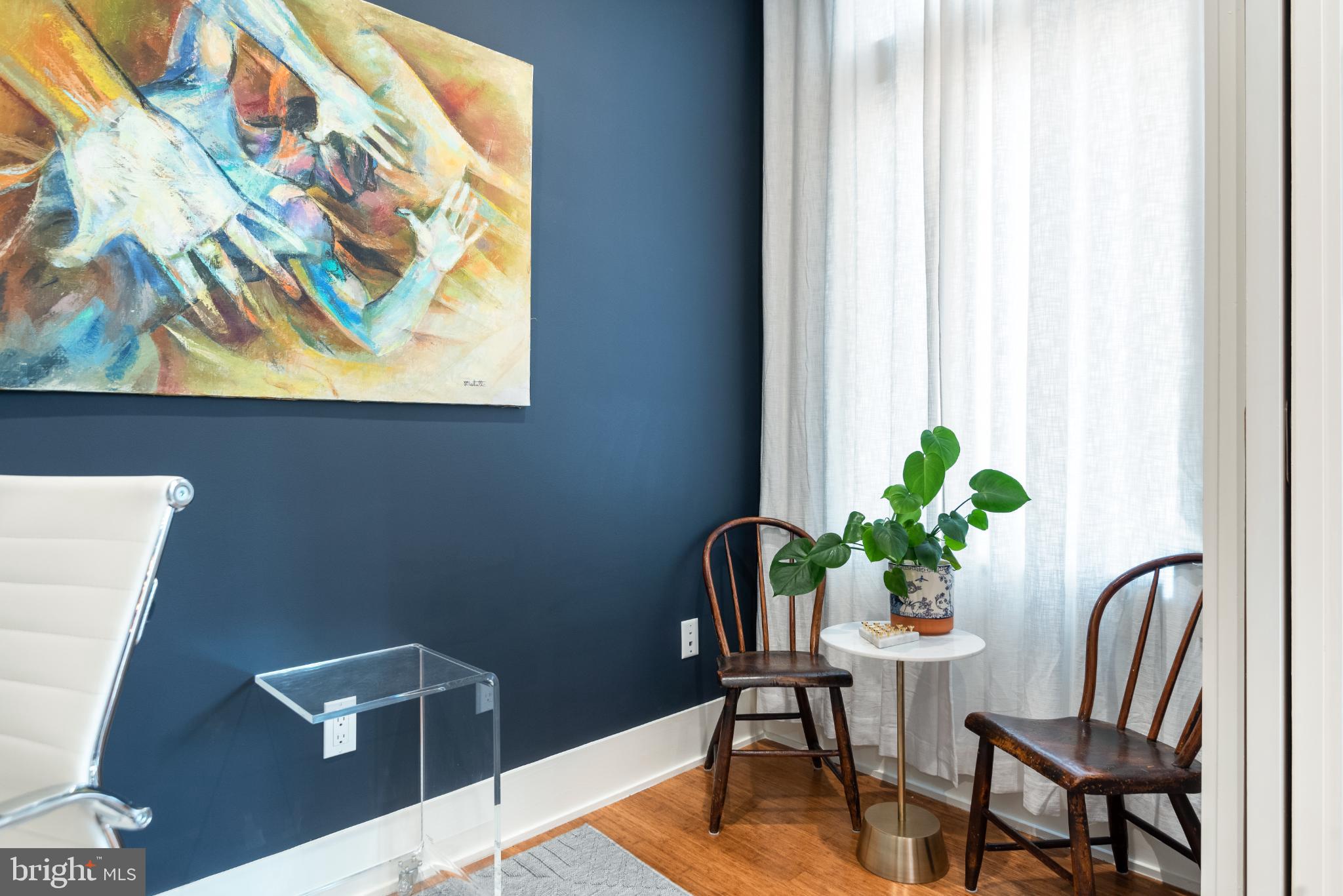 5117 Willet Bridge Road Bethesda, MD 20816 - Photo 10 of 46 a view of a dining room with furniture and a potted plant