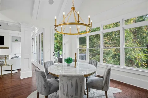 a spacious bathroom with a double vanity sink a mirror and a shower