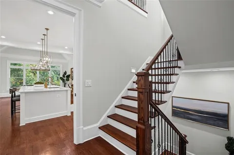 a bedroom with a large bed and a flat screen tv