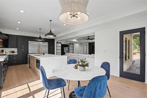 a view of a room with wooden floor and window